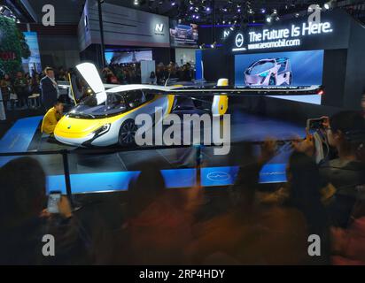 (181109) -- SHANGHAI, Nov. 9, 2018 -- Visitors view a flying car developed by AeroMobil at the first China International Import Expo (CIIE) in Shanghai, east China, Nov. 9, 2018. The CIIE is opened to group visitors from Nov. 9 to Nov. 10. ) (IMPORT EXPO)CHINA-SHANGHAI-CIIE-GROUP VISITORS (CN) XingxGuangli PUBLICATIONxNOTxINxCHN Stock Photo