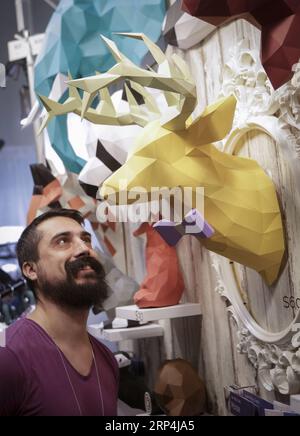 (181110) -- VANCOUVER, Nov. 10, 2018 -- A visitor looks at 3D paper crafts at the Circle Craft Market, Canada s one of the biggest craftspeople s annual events, in Vancouver, Canada, on Nov. 9, 2018. ) (yy) CANADA-VANCOUVER-CIRCLE CRAFT MARKET LiangxSen PUBLICATIONxNOTxINxCHN Stock Photo
