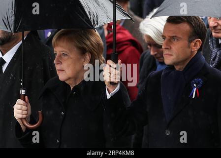 (181111) -- PARIS, Nov. 11, 2018 -- French President Emmanuel Macron and German Chancellor Angela Merkel walk to the ceremony to commemorate the 100th anniversary of the end of World War I in Paris, France, Nov. 11, 2018. )(dh) FRANCE-PARIS-WWI-COMMEMORATION ZhengxHuansong PUBLICATIONxNOTxINxCHN Stock Photo