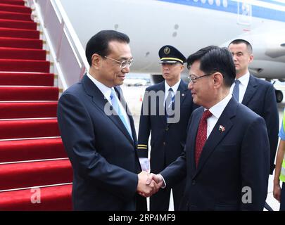 (181112) -- SINGAPORE, Nov. 12, 2018 -- Chinese Premier Li Keqiang (L, front) arrives in Singapore, Nov. 12, 2018. Li arrived here Monday to start his first official visit to Singapore. During the visit, Li is also going to attend the 21st China-ASEAN (the Association of Southeast Asian Nations) (10+1) leaders meeting, the 21st ASEAN-China, Japan and South Korea (10+3) leaders meeting and the 13th East Asia Summit. ) (gxn) SINGAPORE-CHINA-LI KEQIANG-ARRIVAL ZhangxLing PUBLICATIONxNOTxINxCHN Stock Photo