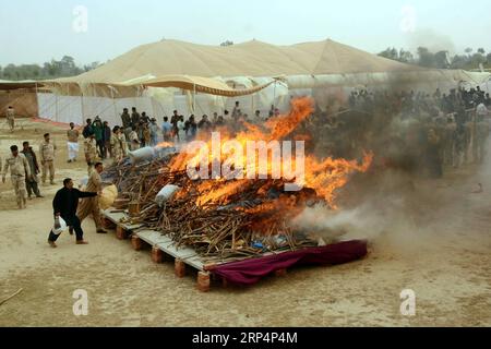 (181115) -- LAHORE, Nov. 15, 2018 -- Anti Narcotics Force (ANF) officials burn a pile of drugs during a drug burning ceremony in eastern Pakistan s Lahore on Nov. 14, 2018. Pakistan Anti Narcotics Force (ANF) on Wednesday burned over 6,500 kg of drugs including heroin, hashish, opium and liquor. ) (lrz) PAKISTAN-LAHORE-DRUGS-BURNING-CEREMONY Sajjad PUBLICATIONxNOTxINxCHN Stock Photo