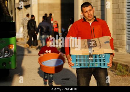 (181115) -- TRIPOLI, Nov. 15, 2018 (Xinhua) -- People carry their belongings waiting to return to Syria in Lebanon s northern city Tripoli, on Nov. 15, 2018. Over 400 Syrian refugees returned on Thursday to their homeland from areas in Lebanon including Bekaa and Aarsal, local media reported. (Xinhua/Khalid)(dtf) LEBANON-TRIPOLI-REFUGEES-SYRIA PUBLICATIONxNOTxINxCHN Stock Photo