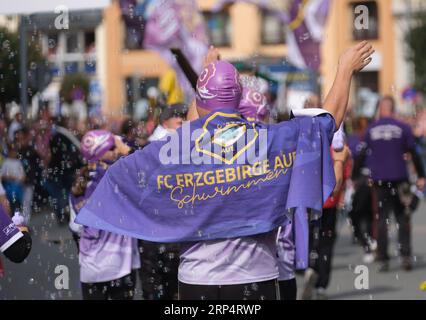 Aue Bad Schlema, Germany. 03rd Sep, 2023. Athletes from the Erzgebirge Aue club walk through the city center during the Day of Saxony parade. Traditionally, Saxony's largest folk and local festival takes place on the first weekend in September. Credit: Sebastian Willnow/dpa/Alamy Live News Stock Photo