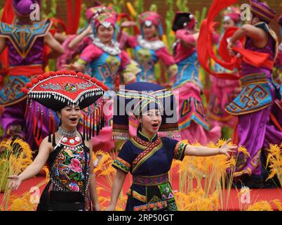 (181122) -- NANNING, Nov. 22, 2018 -- People wearing traditional costumes perform during an event to celebrate the Sanyuesan festival in Nanning, south China s Guangxi Zhuang Autonomous Region, March 30, 2017. Guangxi is a multi-ethnic region and people like to wear ethnic costumes to attend their traditional festivals. The costumes with unique pattern and style reflect diversified ethnic cultures. )(wsw) CHINA-GUANGXI-ETHNIC GROUP-COSTUMES (CN) ZhouxHua PUBLICATIONxNOTxINxCHN Stock Photo