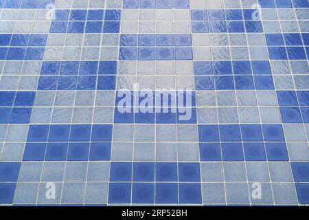 Blue mosaic tiled floor of swimming pool before water filling Stock Photo