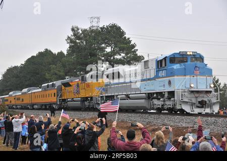 (181206) -- HOUSTON, Dec. 6, 2018 -- People line up along the train route to mourn for the late former U.S. President George H.W. Bush in Houston, Texas, the United States, on Dec. 6, 2018. Bush s remains were taken by the train on Thursday from Houston to the burial site behind the George H.W. Bush Presidential Library and Museum at Texas A&M University. George H.W. Bush, the 41st president of the United States, has died on Nov. 30 at the age of 94. ) U.S.-HOUSTON-GEORGE H.W. BUSH-TRAIN-BURIAL LiuxLiwei PUBLICATIONxNOTxINxCHN Stock Photo