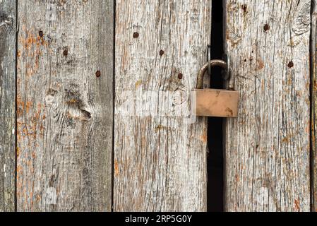 Old rusty lock on metal doors. Lock on the door with an empty place for an inscription Stock Photo