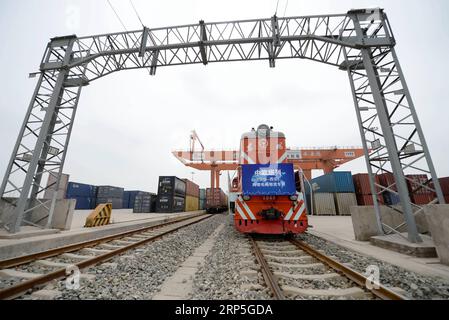 (181214) -- BEIJING, Dec. 14, 2018 (Xinhua) -- Photo taken on May 21, 2018 shows a cross-border e-commerce freight train from Hamburg of Germany arriving in Xi an, northwest China s Shaanxi Province. China-Europe freight trains made 5,611 trips in the first 11 months of 2018, surging 72 percent compared with the same period last year, according to a meeting held in southwest China s Sichuan Province. In 2017, more than 3,000 trips were made via the China-Europe freight trains between cities on the two continents. The number is expected to reach 6,000 in 2018, according to the meeting held by t Stock Photo