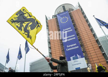 (181216) -- BRUSSELS, Dec. 16, 2018 -- A protester waves a Flemish flag during the March Against Marrakech rally in front of European Union institutions headquarters in Brussels, Belgium, Dec. 16, 2018. Belgian anti-immigration protesters took to the streets of Brussels here on Sunday to denounce the Global Compact for Safe, Orderly and Regular Migration adopted in Marrakech, Morocco. ) BELGIUM-BRUSSELS-ANTI-IMMIGRATION-RALLY-PROTEST ZhengxHuansong PUBLICATIONxNOTxINxCHN Stock Photo