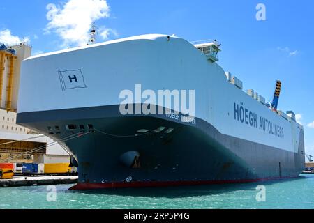 Valletta, Malta - 6 August 2023: Large car transporter ship Hoegh Trapper docked in the port of Valletta. Stock Photo