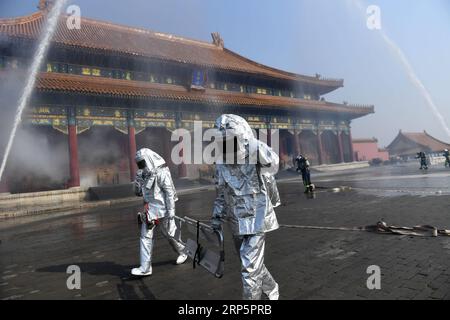 (181221) -- BEIJING, Dec. 21, 2018 (Xinhua) -- File photo taken on Oct. 10, 2016 shows people participating in a fire drill held at the Palace Museum in Beijing, capital of China. The Palace Museum, also known as the Forbidden City, has taken new approaches, such as TV show, music and games, to promote its cultural relics and Chinese traditional culture. It reaches out to the public with new digital technology by integrating modern technology with its history and splendid traditional culture spanning 600 years. Visitors may walk directly into the emperor s residence and, through VR, see everyt Stock Photo