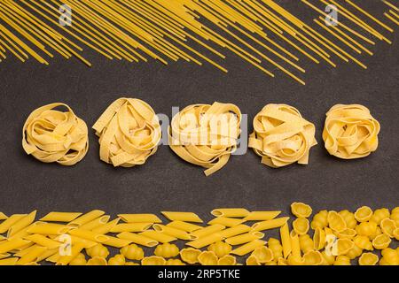 Organic food.Variety of types and shapes of dry Italian pasta. Top view Stock Photo