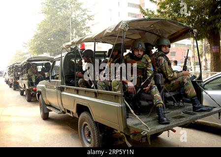 DHAKA, -- Army soldiers are deployed on a street during the ...