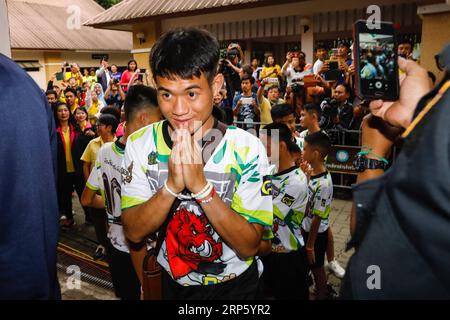 (181227) -- BEIJING, Dec. 27, 2018 -- Photo taken on July 18, 2018 shows the 12 boys and their football coach rescued from a flooded cave in northern Thailand make their first public appearance at a press conference in Bangkok, Thailand. A Thai soccer team of 12 boys aging between 11 and 16 and their coach were trapped in a flooded cave on June 23. All of them were successfully rescued after 18 days, thanks to the joint efforts by more than 1,000 personnel from local and international rescue teams from China, the United States, Britain and other countries. ) TOP 10 WORLD SPORTS NEWS EVENTS 201 Stock Photo