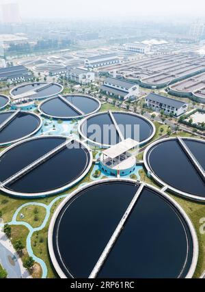 (181230) -- BEIJING, Dec. 30, 2018 (Xinhua) -- This aerial photo taken on July 26, 2018 shows waste water disposal facilities within a printing and dyeing industrial zone in Shaoxing, east China s Zhejiang Province. Starting from 2010, the printing and dyeing factories scattered around Keqiao District of Shaoxing have gone through a three-phase restructuring scheme, which managed to gather them in a dedicated industrial zone equipped with eco-friendly utilities and waste disposal facilities. China has pledged to coordinate its efforts of environmental protection and economic development in 201 Stock Photo