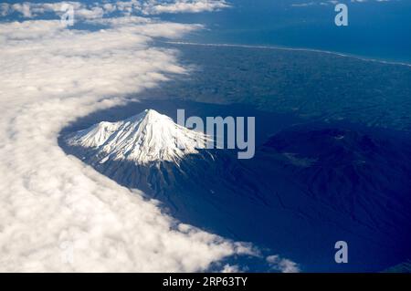 (190101) -- NEW PLYMOUTH, Jan. 1, 2019 (Xinhua) -- File photo taken on June 8, 2018 shows an aerial view of Mount Taranaki in New Plymouth, New Zealand. People called Mount Taranaki beautiful but deadly since nearly 100 people have died in climbing accidents on the slopes of Mt Taranaki since records began in the 1890s. Local scientist predicted that Mt Taranaki is due geologically speaking for an eruption - and it could be catastrophic if it happened one day. (Xinhua/Guo Lei) NEW ZEALAND-NEW PLYMOUTH-MT TARANAKI-SCENERY PUBLICATIONxNOTxINxCHN Stock Photo