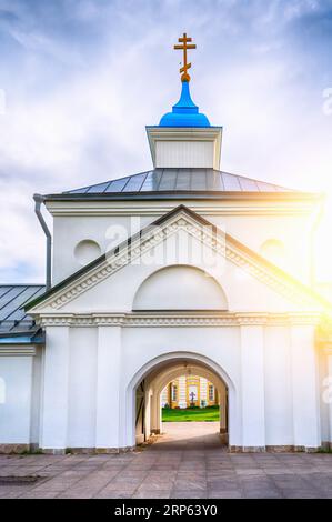 Konevsky Monastery on Konevets Island on Lake Ladoga - Russia. The central entrance with the gate church on the zakta in the sunlight. Stock Photo
