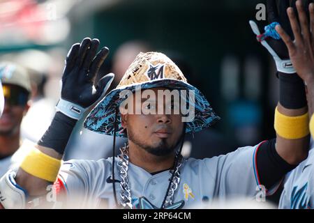 Miami Marlins' Jazz Chisholm Jr. bats during the second inning in the first  baseball game of a doubleheader against the Cleveland Guardians, Saturday,  April 22, 2023, in Cleveland. (AP Photo/Nick Cammett Stock