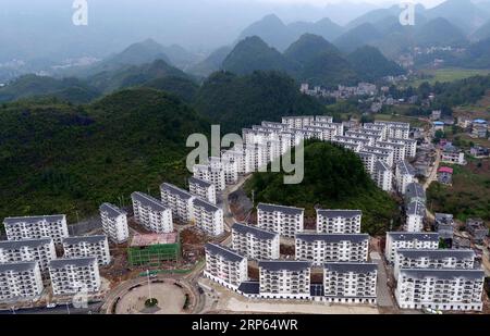 (190102) -- BEIJING, Jan. 2, 2019 (Xinhua) -- Aerial photo taken on Oct. 15, 2018 shows a view of the Songping settlement for poverty relief relocation in Shadaogou Town of Xuan en County, central China s Hubei Province. The 18th Central Committee of the Communist Party of China (CPC) held the third plenary session in November, 2013. In the five years since then, China s reform momentum had been particularly strong as the CPC decided to advance reform in all aspects during the meeting. Since the third plenary session, Chinese President Xi Jinping has presided over at least 45 high-profile meet Stock Photo