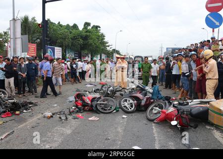 News Bilder des Tages (190102) -- HANOI, Jan. 2, 2019 () -- Traffic police officers investigate at a road accident scene in Ben Luc district of Long An province, Vietnam, Jan. 2, 2019. A tractor trailer crashed into nearly 20 motorbikes, which stopped at a traffic light in Vietnam s southern Long An province Wednesday afternoon, killing at least six people and injuring 22 others, local media reported. The accident, involving the tractor trailer and 18 motorbikes on national road 1A, killed five people instantly and injured 23 others, of whom one died in hospital later, national radio station V Stock Photo