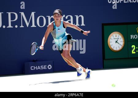 New York, United States. 03rd Sep, 2023. Xinyu Wang of China chases a shot by Karolina Muchova of the Czech Republic during their fourth round match at the US Open. Muchova won in three sets. Photography by Credit: Adam Stoltman/Alamy Live News Stock Photo