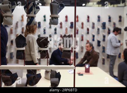 (190108) -- FLORENCE (ITALY), Jan. 8, 2019 -- People visit the 95th Pitti Immagine Uomo exhibition in Florence, Italy, Jan. 8, 2019. The exhibition, one of the world s most important platforms for men s clothing and accessory collections, is held here from Jan. 8 to 11. ) ITALY-FLORENCE-MEN S CLOTHING AND ACCESSORY-EXHIBITION ChengxTingting PUBLICATIONxNOTxINxCHN Stock Photo