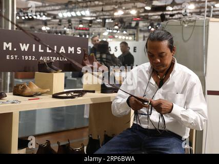 (190108) -- FLORENCE (ITALY), Jan. 8, 2019 -- An exhibitor makes a belt during the 95th Pitti Immagine Uomo exhibition in Florence, Italy, Jan. 8, 2019. The exhibition, one of the world s most important platforms for men s clothing and accessory collections, is held here from Jan. 8 to 11. ) ITALY-FLORENCE-MEN S CLOTHING AND ACCESSORY-EXHIBITION ChengxTingting PUBLICATIONxNOTxINxCHN Stock Photo