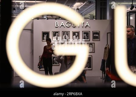 (190108) -- FLORENCE (ITALY), Jan. 8, 2019 -- People visit the 95th Pitti Immagine Uomo exhibition in Florence, Italy, Jan. 8, 2019. The exhibition, one of the world s most important platforms for men s clothing and accessory collections, is held here from Jan. 8 to 11. ) ITALY-FLORENCE-MEN S CLOTHING AND ACCESSORY-EXHIBITION ChengxTingting PUBLICATIONxNOTxINxCHN Stock Photo