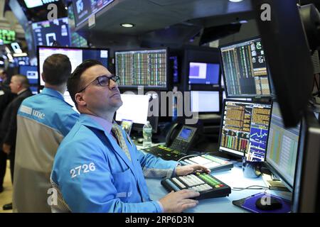 (190109) -- NEW YORK, Jan. 9, 2019 -- Traders work at the New York Stock Exchange in New York, the United States, Jan. 9, 2019. U.S. stocks closed higher on Wednesday after the summary of Federal Reserve s meeting held in December showed the central bank is patient on rate hikes. The Dow Jones Industrial Average increased 91.67 points, or 0.39 percent, to 23,879.12. The S&P 500 was up 10.55 points, or 0.41 percent, to 2,584.96. The Nasdaq Composite Index was up 60.08 points, or 0.87 percent, to 6,957.08. ) U.S.-NEW YORK-STOCKS WangxYing PUBLICATIONxNOTxINxCHN Stock Photo