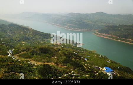 (190110) -- BEIJING, Jan. 10, 2019 (Xinhua) -- Aerial photo taken on April 8, 2018 shows a view of the Yangtze River and its green banks in Wanzhou District of Chongqing, southwest China. In November 2013, the 18th Central Committee of the Communist Party of China held its third plenary session to focus on comprehensively deepening reform. In the five years after the session, China s ecological civilization system has been rapidly taking shape and the ecological environment is significantly improved. (Xinhua/Liu Chan) CHINA-ENVIRONMENTAL PROTECTION (CN) PUBLICATIONxNOTxINxCHN Stock Photo