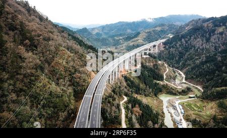 (190111) -- LIBO, Jan. 11, 2019 (Xinhua) -- Aerial photo taken on Jan. 11, 2019 shows a section of Libo-Rongjiang expressway in southwest China s Guizhou Province. Opened to traffic on Friday, the expressway is about 67 kilometers long and has a design speed of 80 kilometers per hour. (Xinhua/Tao Liang) CHINA-GUIZHOU-EXPRESSWAY-OPEN (CN) PUBLICATIONxNOTxINxCHN Stock Photo