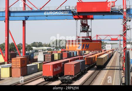 (190115) -- BEIJING, Jan. 15, 2019 (Xinhua) -- A cargo container on a China Railway Express train is unloaded at Eurokombi terminal in Hamburg, Germany, on May 29, 2018. China s foreign trade rose 9.7 percent year on year to a historic high of 30.51 trillion yuan (about 4.5 trillion U.S. dollars) in 2018, the General Administration of Customs (GAC) said Monday. Exports rose 7.1 percent year on year to 16.42 trillion yuan last year, while imports grew 12.9 percent to 14.09 trillion yuan, resulting in a trade surplus of 2.33 trillion yuan, which narrowed by 18.3 percent. Exports and imports of p Stock Photo