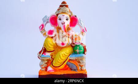 Indian God idol or statue isolated on white. Maa laxmi with Lord Ganesha, Adiyogi, Godess Durga on lion and Lord krishana Statue. Stock Photo