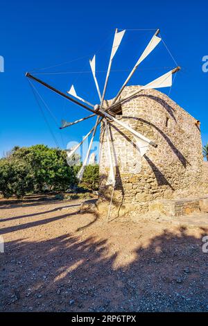 Traditional windmill at Toplou monastery, close to famous Vai beach, Sitia municipality, Lasithi prefecture. Stock Photo