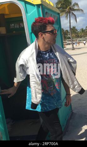 MIAMI BEACH, FL - FEBRUARY 21: (EXCLUSIVE COVERAGE) Looks like Singer Joe Jonas star power and fame has slipped a little as he is forced to use an out house or porta-potty on February 21, 2016 in Miami Beach, Florida.  People:  Joe Jonas Stock Photo