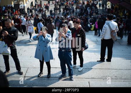 (190123) -- MACAO, Jan. 23, 2019 (Xinhua) -- Tourists visit the Ruins of St. Paul s in Macao, south China, Jan. 23, 2019. Visitor arrivals in China s Macao Special Administrative Region (SAR) made a record of 35.80 million in 2018, up by 9.8 percent year-on-year, the SAR s statistics service said on Wednesday. Visitor arrivals by land surged by 18.9 percent year-on-year to 22.15 million in 2018, with 1.05 million of them entering the Macao SAR via the Hong Kong-Zhuhai-Macao Bridge. (Xinhua/Cheong Kam Ka) CHINA-MACAO-TOURISM (CN) PUBLICATIONxNOTxINxCHN Stock Photo