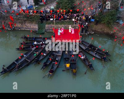 (190124) -- HANGZHOU, Jan. 24, 2019 (Xinhua) -- Aerial photo taken on Jan. 23, 2019 shows villagers watching traditional opera in Hexidai Village of Tangqi Township in Hangzhou, capital of east China s Zhejiang Province. Traditional Chinese classical operas like Liang Shanbo and Zhu Yingtai , also known as The Butterfly Lovers are staged in Hexidai Village ahead of the Lunar New Year, or Spring Festival, which falls on Feb. 5 this year. (Xinhua/Xu Yu) CHINA-ZHEJIANG-LUNAR NEW YEAR-FOLK OPERA (CN) PUBLICATIONxNOTxINxCHN Stock Photo