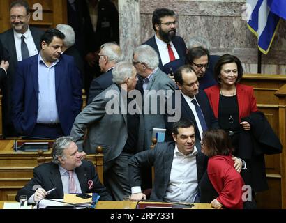 (190125) -- ATHENS, Jan. 25, 2019 -- Greek Prime Minister Alexis Tsipras (2nd R, Front) is greeted after the vote on a deal of the use of the name Macedonia in Athens, Greece, on Jan. 25, 2019. Greece s parliament approved on Friday the historic agreement reached last summer which resolves a nearly 28-year-old dispute between Greece and the Former Yugoslav Republic of Macedonia (FYROM) over the use of the name Macedonia. ) GREECE-ATHENS-PARLIAMENT-MACEDONIA NAME AGREEMENT-RATIFYING MariosxLolos PUBLICATIONxNOTxINxCHN Stock Photo