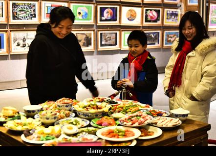 (190126) -- HEFEI, Jan. 26, 2019 (Xinhua) -- Visitors view the Spring Festival dishes made of polymer clay during an exhibition at Laishaoqi Gallery in Hefei, capital of east China s Anhui Province, Jan. 25, 2019. The Spring Festival, or the Chinese Lunar New Year which falls on Feb. 5 this year, is the most important festival in China. On New Year s Eve, the biggest event is the annual family reunion dinner. (Xinhua/Ge Yinian) CHINA-HEFEI-FEAST-POLYMER CLAY (CN) PUBLICATIONxNOTxINxCHN Stock Photo