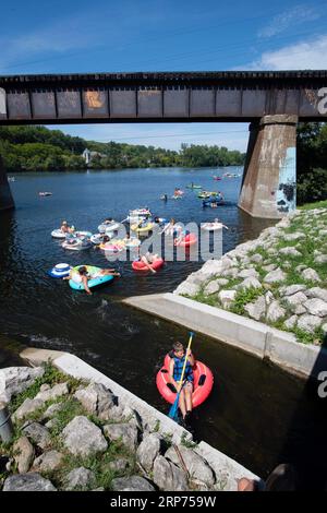 Ann Arbor, Michigan, USA. 3rd Sep, 2023. People enjoy the hot weather on Labor Day Weekend by floating down The Argo Cascades. The Cascades is a series of nine small rapids that connect two parts of the Huron River in Ann Arbor. (Credit Image: © Mark Bialek/ZUMA Press Wire) EDITORIAL USAGE ONLY! Not for Commercial USAGE! Stock Photo