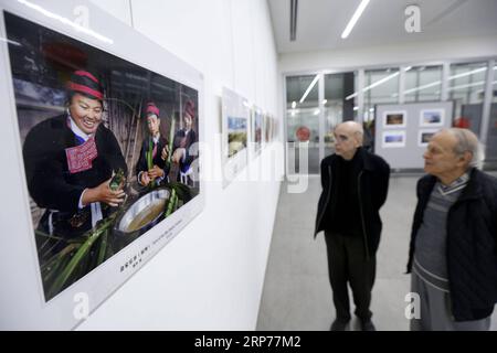 (190130) -- BEIRUT, Jan. 30, 2019 -- Visitors look at photos during a photo exhibition commemorating the 40th anniversary of China s reform and opening-up in Beirut, Lebanon, on Jan. 30, 2019. The photo exhibition on the 40th anniversary of China s reform and opening-up, jointly held by Chinese Embassy in Lebanon and the Lebanese Academy of Fine Arts, opened here on Wednesday and will last till Feb. 2. ) LEBANON-BEIRUT-PHOTO EXHIBITION-CHINA-REFORM AND OPENING-UP BilalxJawich PUBLICATIONxNOTxINxCHN Stock Photo