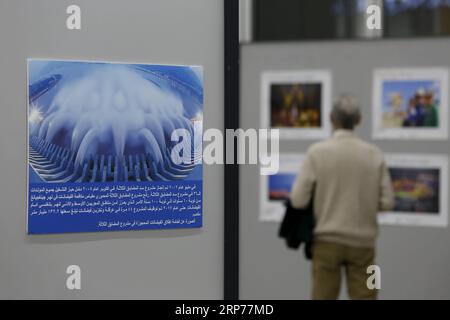 (190130) -- BEIRUT, Jan. 30, 2019 -- A visitor looks at photos during a photo exhibition commemorating the 40th anniversary of China s reform and opening-up in Beirut, Lebanon, on Jan. 30, 2019. The photo exhibition on the 40th anniversary of China s reform and opening-up, jointly held by Chinese Embassy in Lebanon and the Lebanese Academy of Fine Arts, opened here on Wednesday and will last till Feb. 2. ) LEBANON-BEIRUT-PHOTO EXHIBITION-CHINA-REFORM AND OPENING-UP BilalxJawich PUBLICATIONxNOTxINxCHN Stock Photo