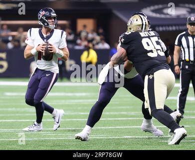 New Orleans, USA. 27th Aug, 2023. Houston Texans offensive tackle Austin  Deculus (76) and center Jarrett Patterson (68) both close in on New Orleans  Saints defensive end Kyle Phillips (91) During a