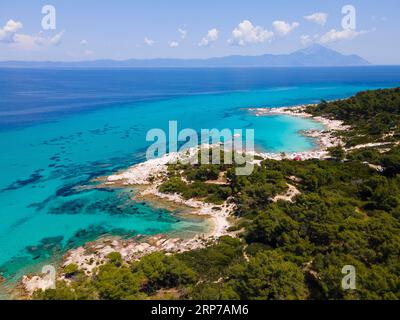 Aerial view, blue, clear water, bay at Mega Portokali beach, Kavourotrypes beach and Orange Beach, Sarti, Sithonia, Chalkidiki, Central Macedonia Stock Photo