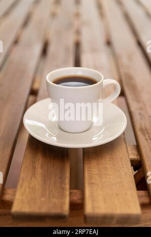 Minimalistic coffee cup wooden table Stock Photo