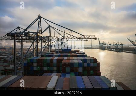 (190206) -- ANTWERP, Feb. 6, 2019 -- Photo taken on Feb. 5, 2019 shows cargo containers on COSCO SHIPPING LIBRA at the Port of Antwerp in Belgium. China s 20,000 plus twenty-foot equivalent unit (TEU) container vessel COSCO SHIPPING LIBRA docked at the Port of Antwerp on Tuesday. ) BELGIUM-ANTWERP-COSCO CONTAINERSHIP ZhangxCheng PUBLICATIONxNOTxINxCHN Stock Photo
