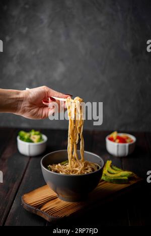 Noodles bowl with avocado copy space Stock Photo