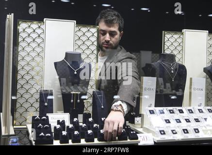 (190206) -- BEIJING, Feb. 6, 2019 -- Photo taken on Feb. 1, 2019 shows a staff member arranging jewelry at a store in downtown Antwerp, Belgium, where is a hub for global diamond processing and trading center. ) Xinhua Headlines: Made-in-China diamonds poised to shape global market YexPingfan PUBLICATIONxNOTxINxCHN Stock Photo