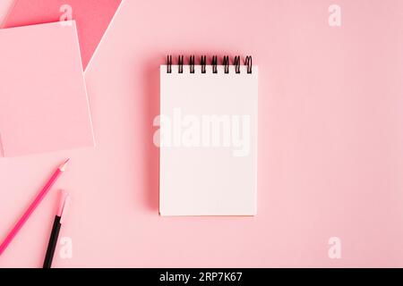 Notepad office supplies colored surface Stock Photo