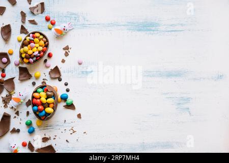 Cute bunnies near easter sweets Stock Photo